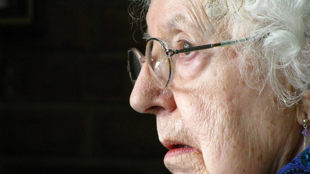 Side view portrait of an elderly woman with glasses